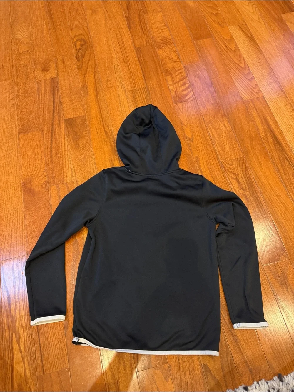 Under Armour Kid’s Black Zip-Up Logo Hoodie with White Trim